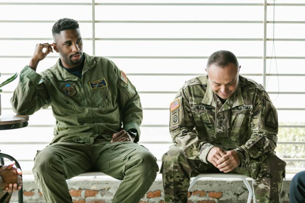 Military veterans engage in a therapeutic group session focused on healing and support.